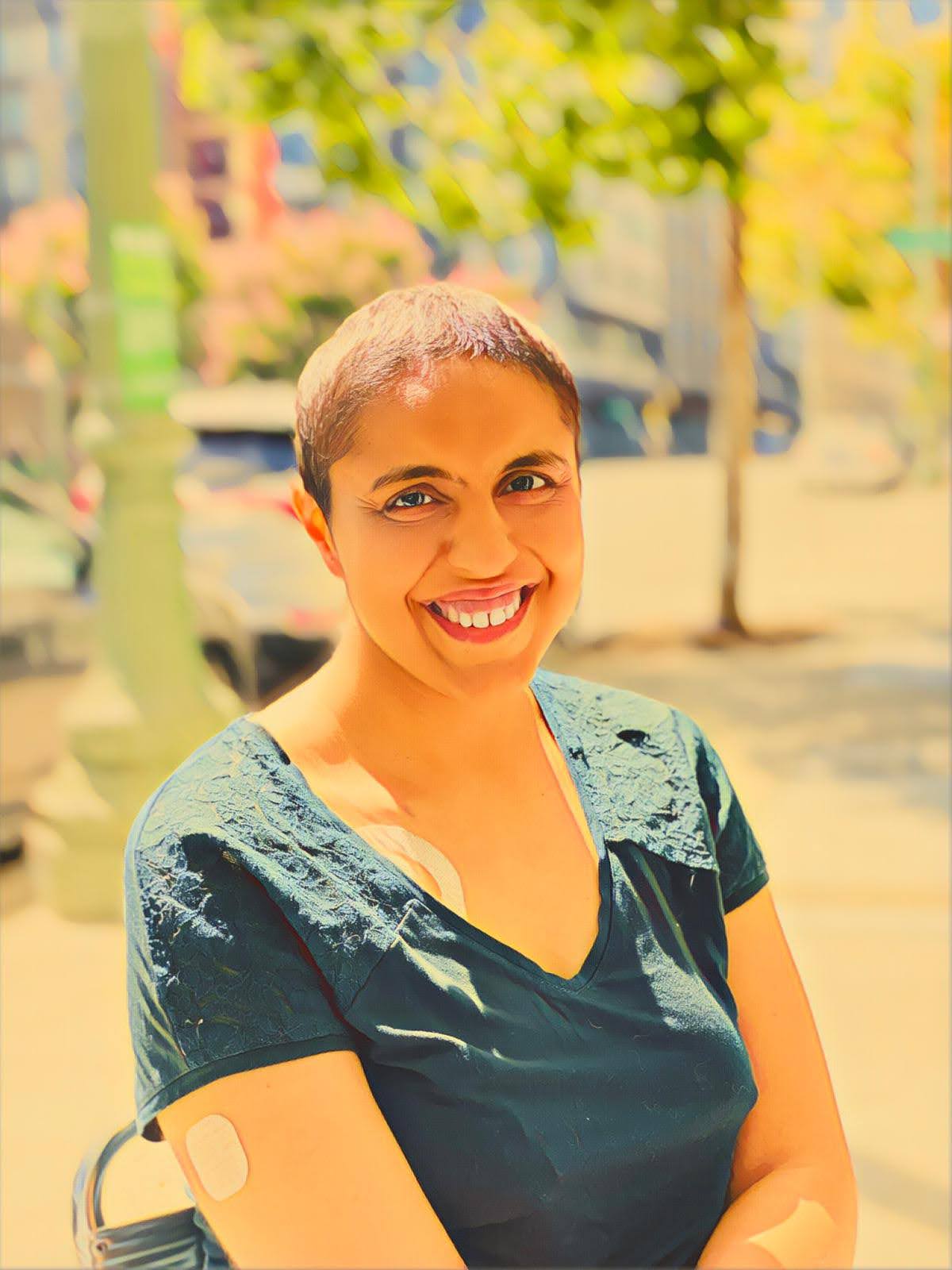 Ridhima Khurana during chemotherapy, smiling - cancer survivor and PM interview coach